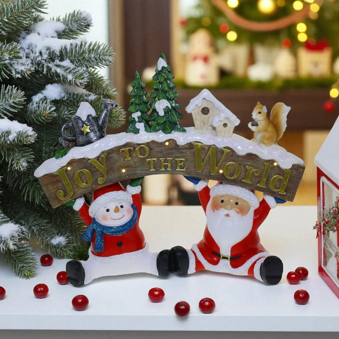 Santa and snowman holding 'Joy to the World' sign with Christmas trees, squirrel, and lights for festive home décor