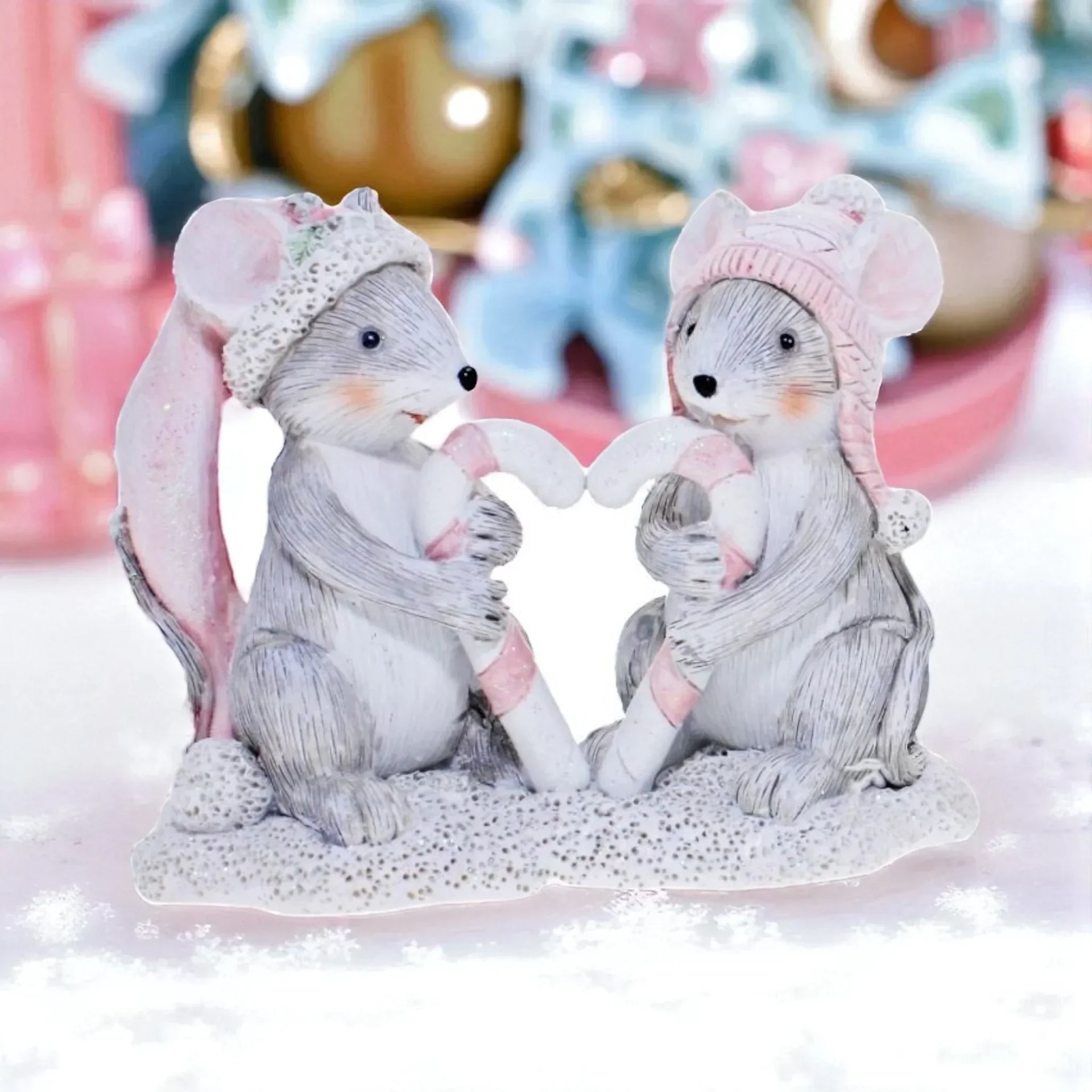Charming winter mouse figurines holding candy canes, festive home décor for Christmas holidays