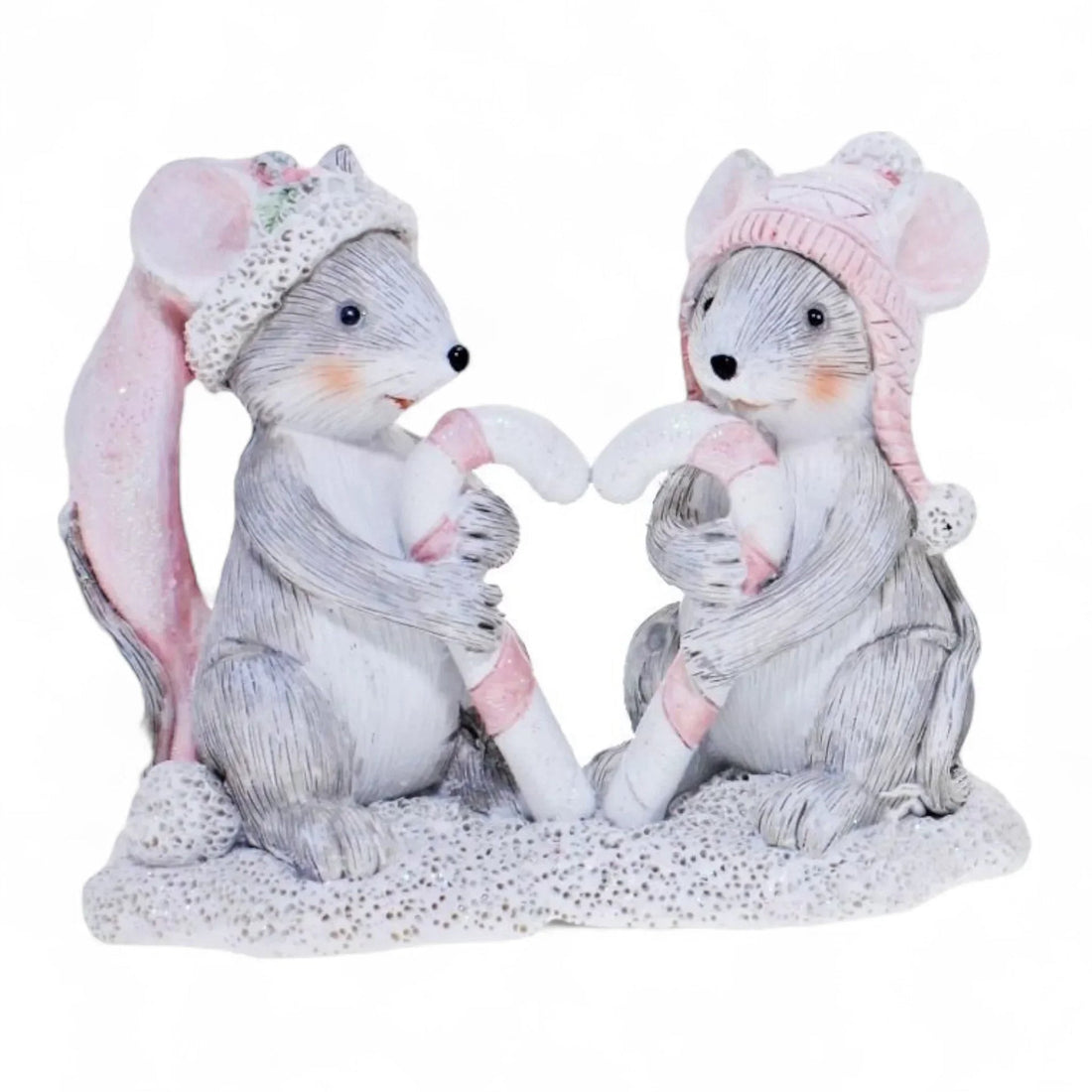 Charming mouse figurines in pink hats holding candy canes, perfect for holiday home décor