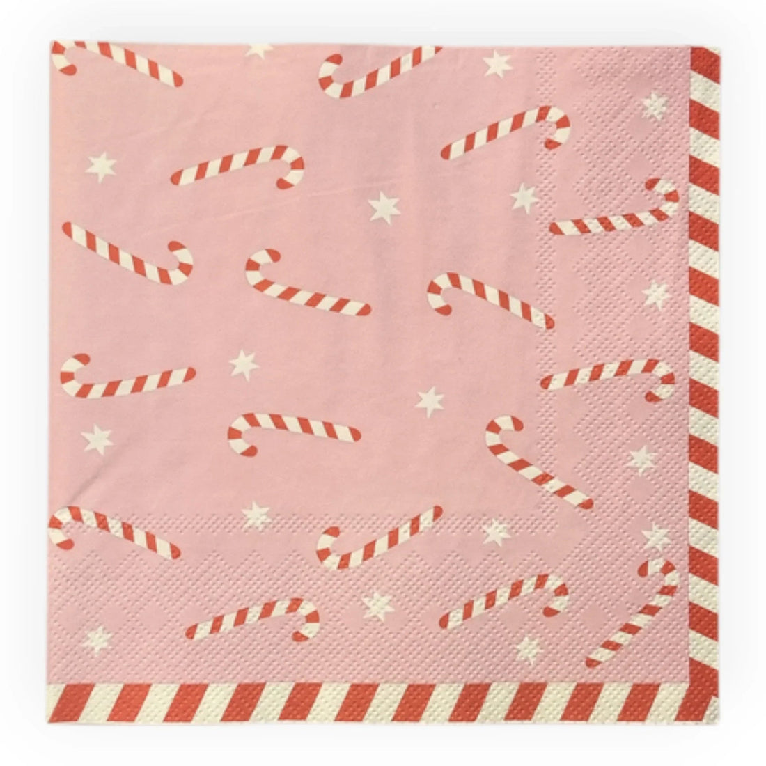 Pink holiday napkin with candy cane and star pattern, festive tableware for Christmas celebrations