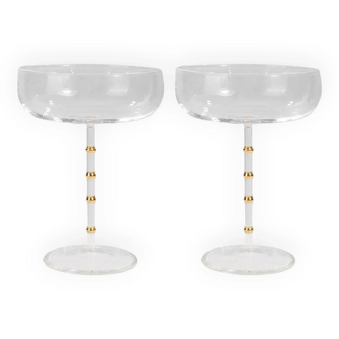 Elegant champagne coupes with gold-accented stems, perfect for luxury home décor and vintage-inspired entertaining.