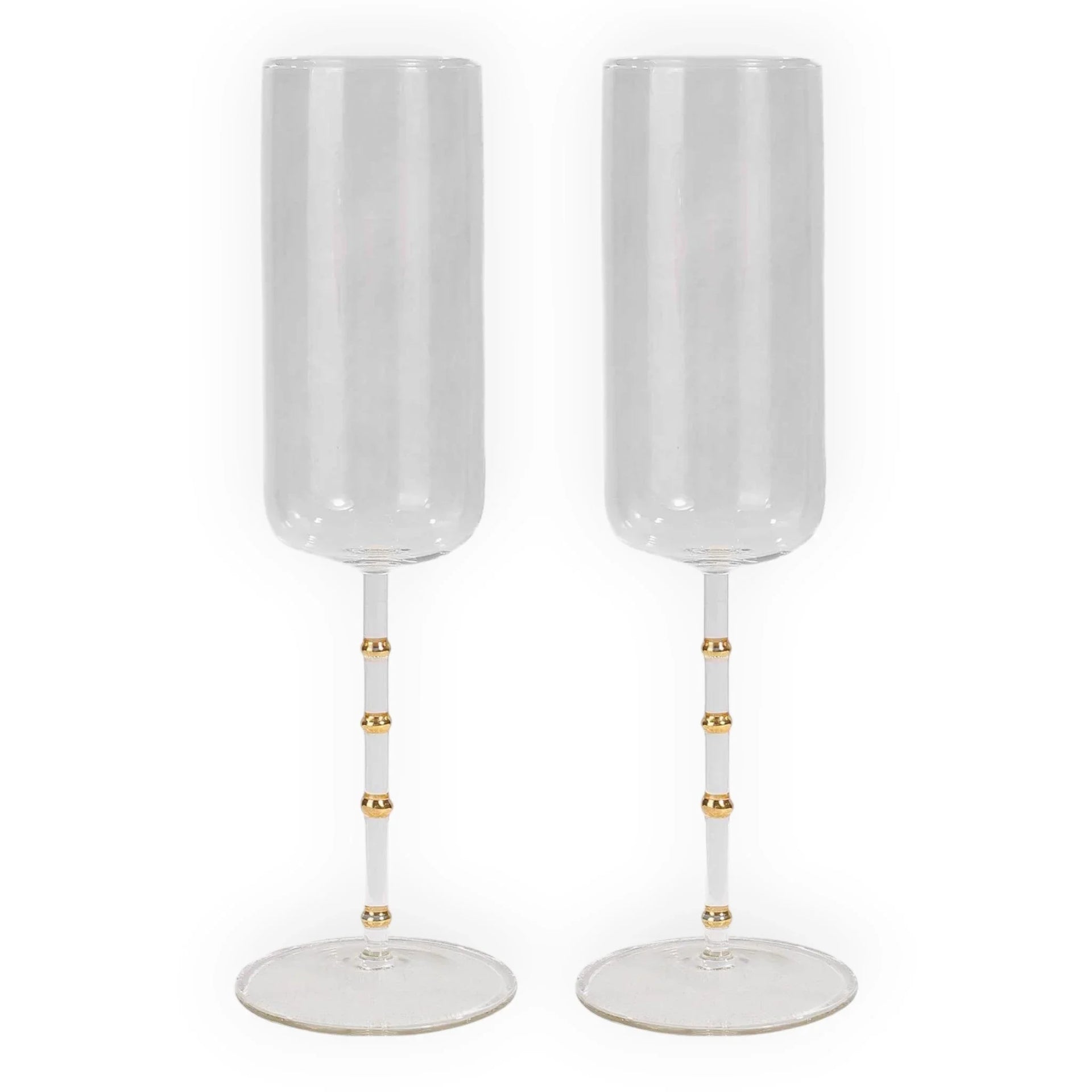 Elegant champagne flutes with gold accents, perfect for luxury home décor and special occasions.
