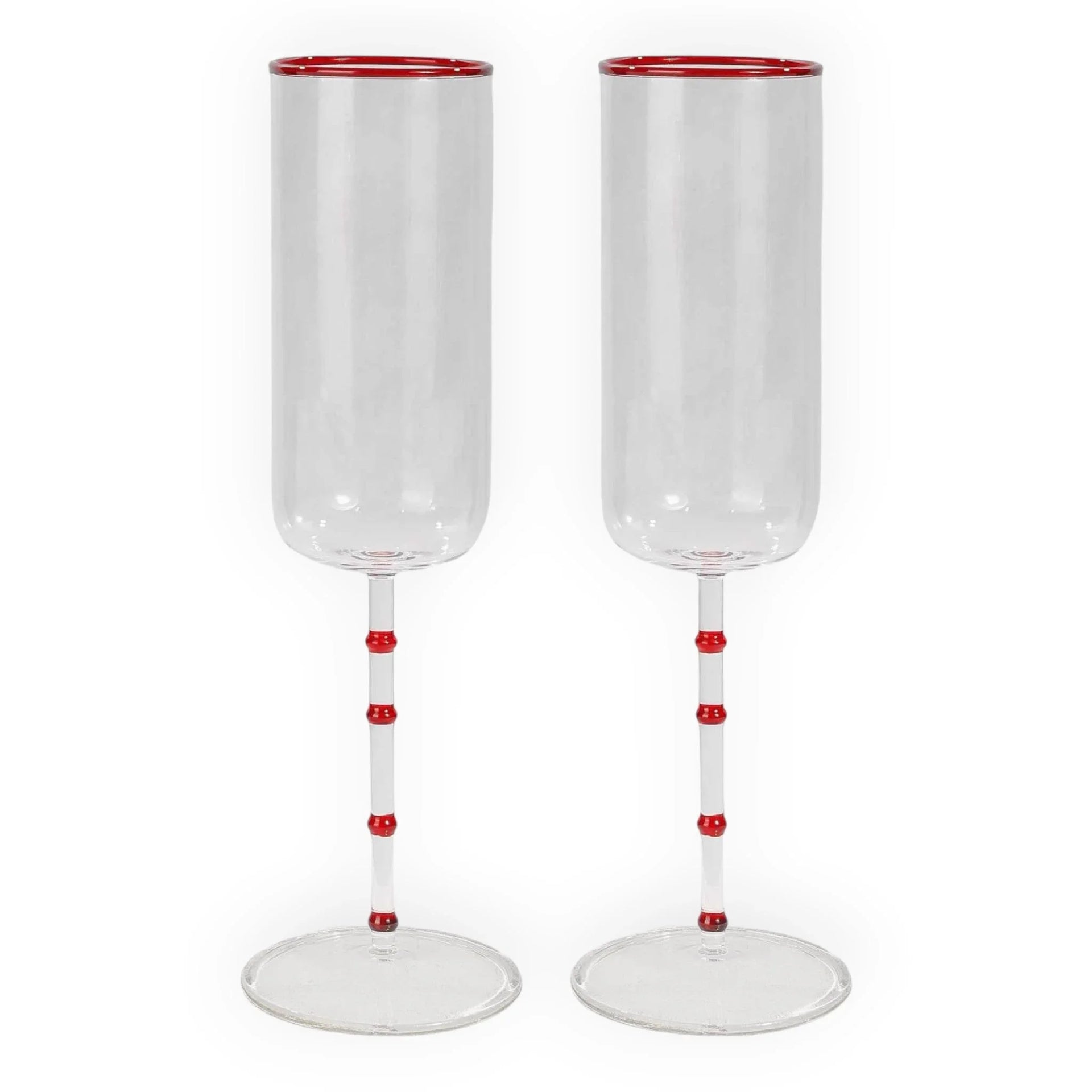 Elegant red-accented champagne flutes with bamboo-style stems, perfect for luxury home décor and special occasions.