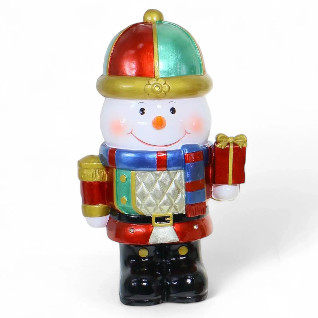Cheerful snowman nutcracker holding gift, festive holiday decor with red, green, and gold accents