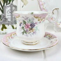Elegant floral teacup and saucer with gold trim, perfect for home decor and tea time.