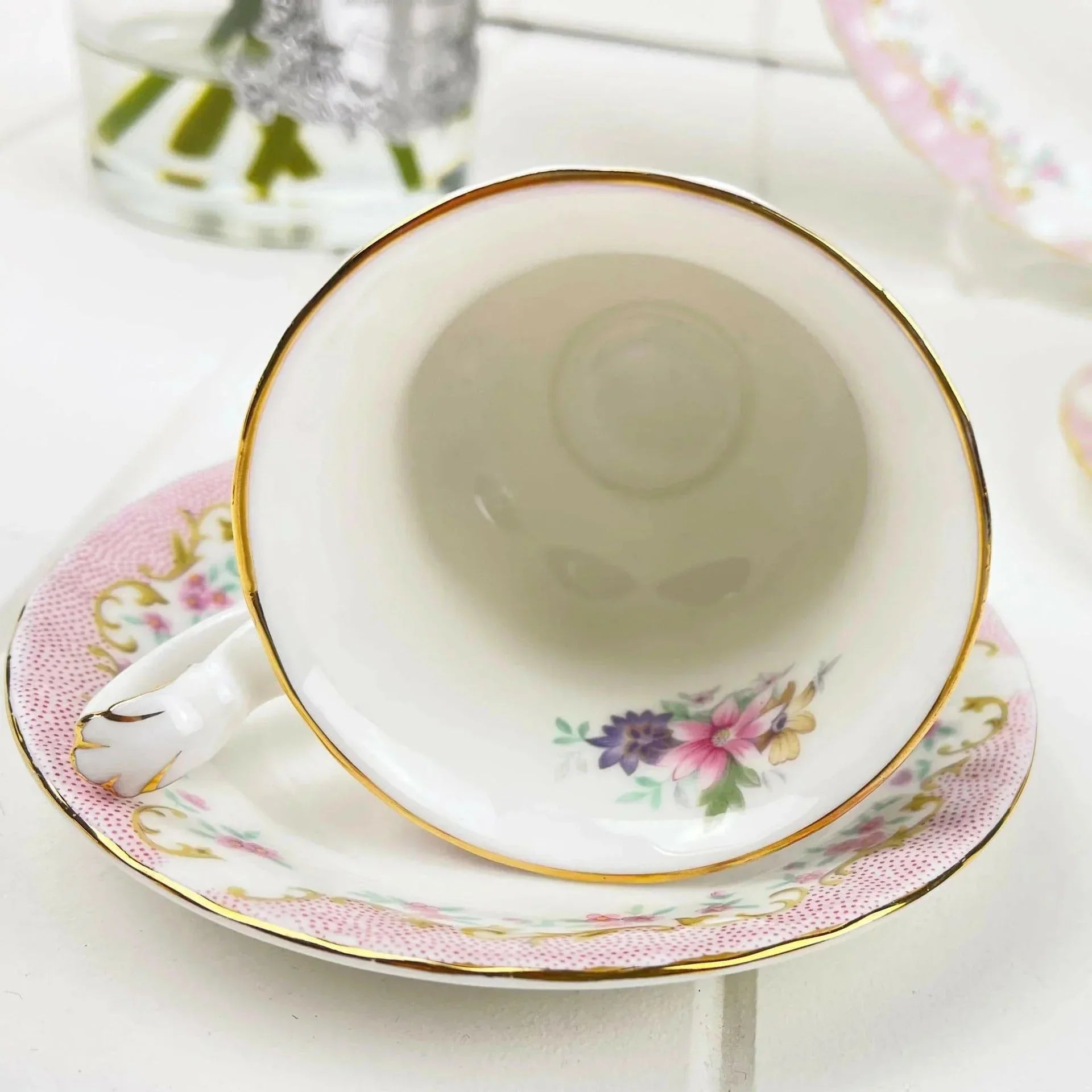 Elegant floral teacup and saucer with gold trim, perfect for home decor and tea service