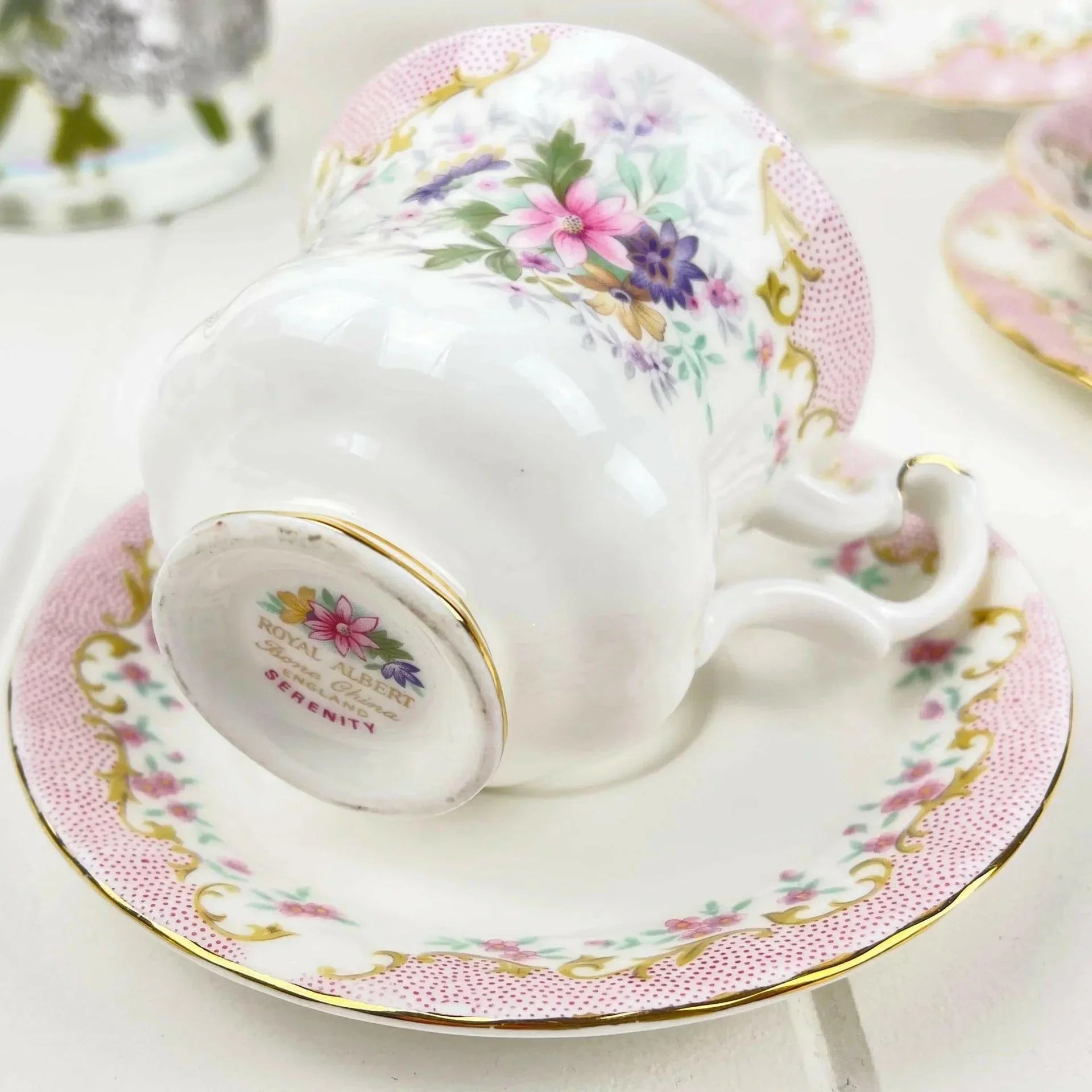 Elegant floral teacup and saucer with gold trim, perfect for home decor and tea lovers.