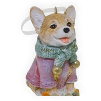 Adorable corgi ornament in pink dress & green scarf, perfect for holiday home décor and festive gifting.